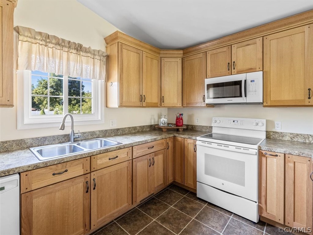 10417 River Road Petersburg, VA 23803 - Photo 12 of 29 a kitchen with sink cabinets and window