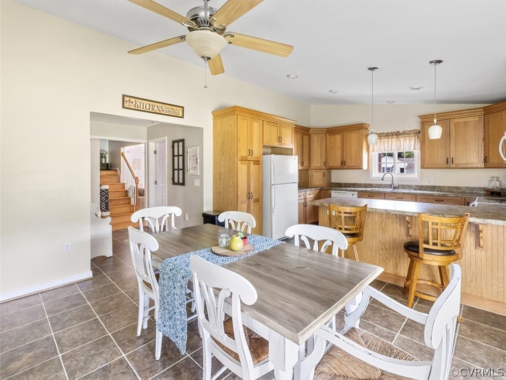 10417 River Road Petersburg, VA 23803 - Photo 14 of 29 a view of a dining room with furniture and a chandelier