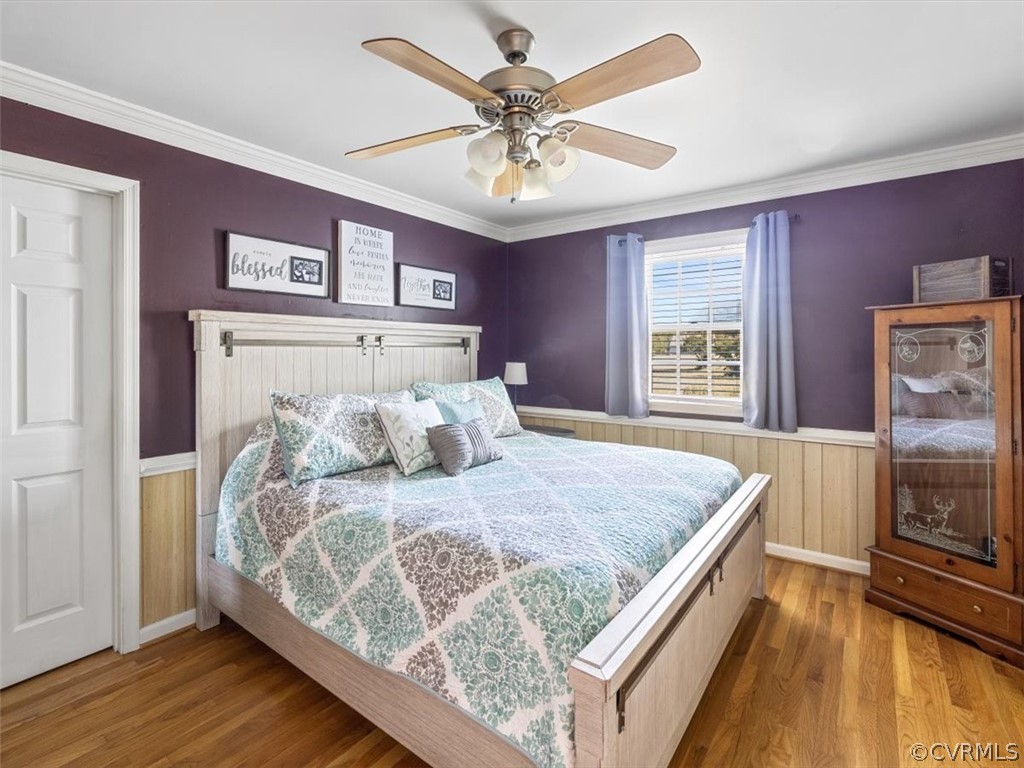 10417 River Road Petersburg, VA 23803 - Photo 17 of 29 a bedroom with a bed and a flat screen tv