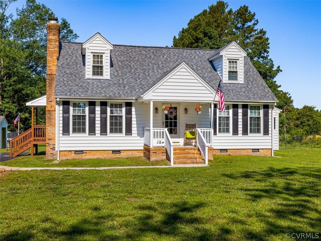10417 River Road Petersburg, VA 23803 - Photo 2 of 29 a front view of a house with garden and porch