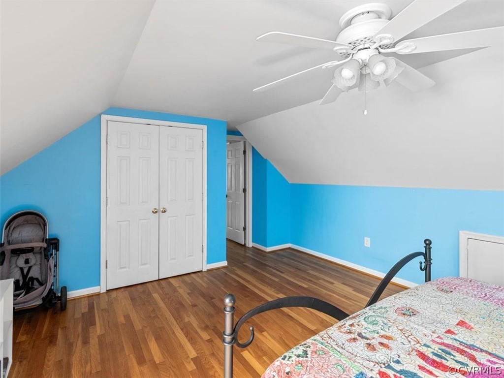 10417 River Road Petersburg, VA 23803 - Photo 21 of 29 a bedroom with a bed and a chandelier