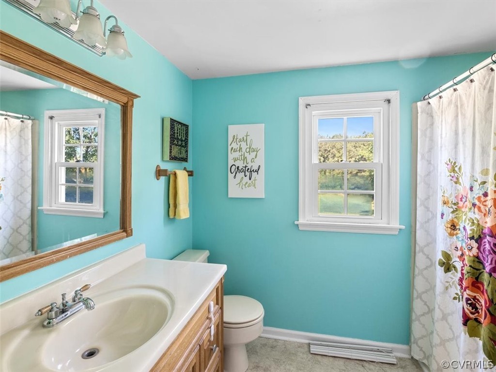 10417 River Road Petersburg, VA 23803 - Photo 22 of 29 a bathroom with a sink and toilet