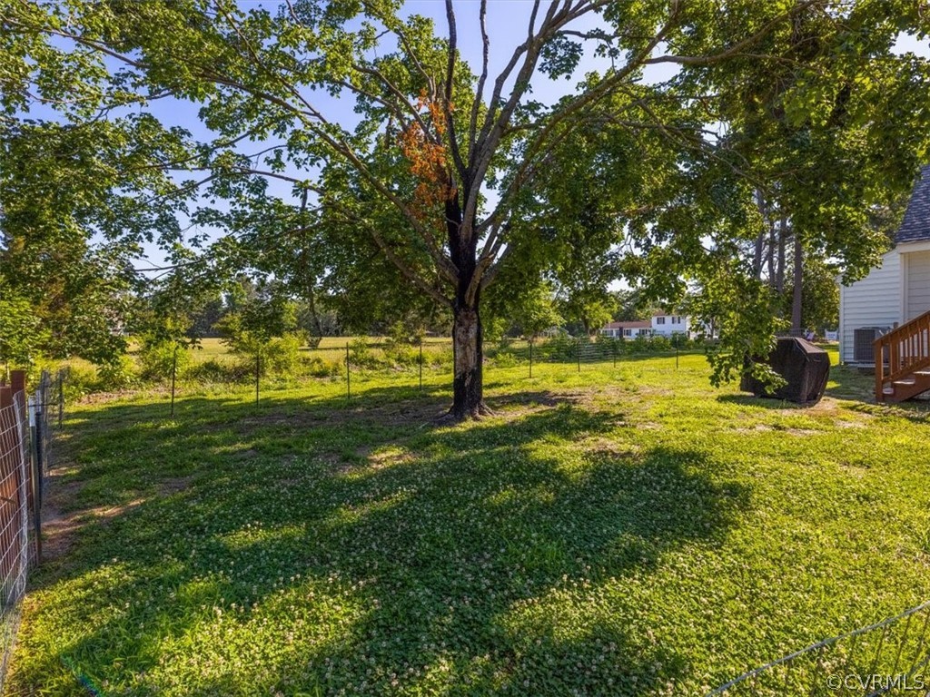 10417 River Road Petersburg, VA 23803 - Photo 27 of 29 a view of yard with swimming pool and green space