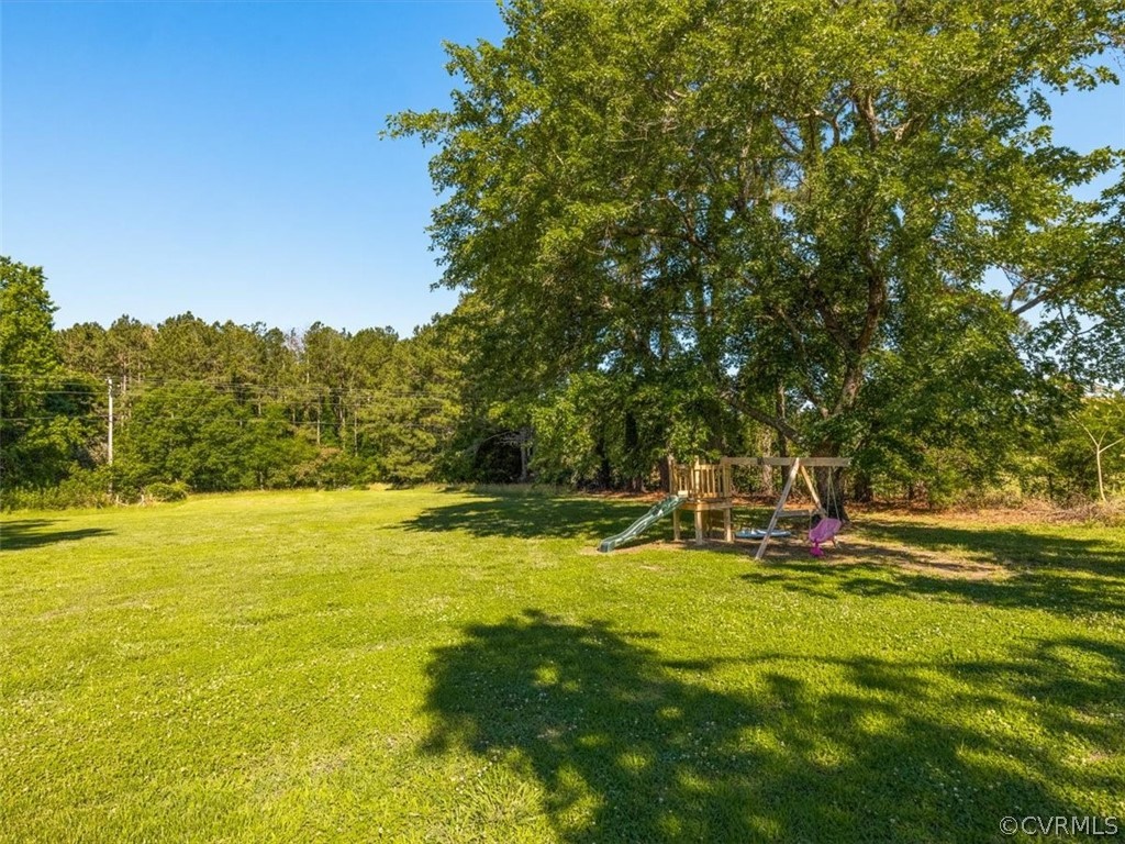 10417 River Road Petersburg, VA 23803 - Photo 28 of 29 a view of a swimming pool with an outdoor space and seating area