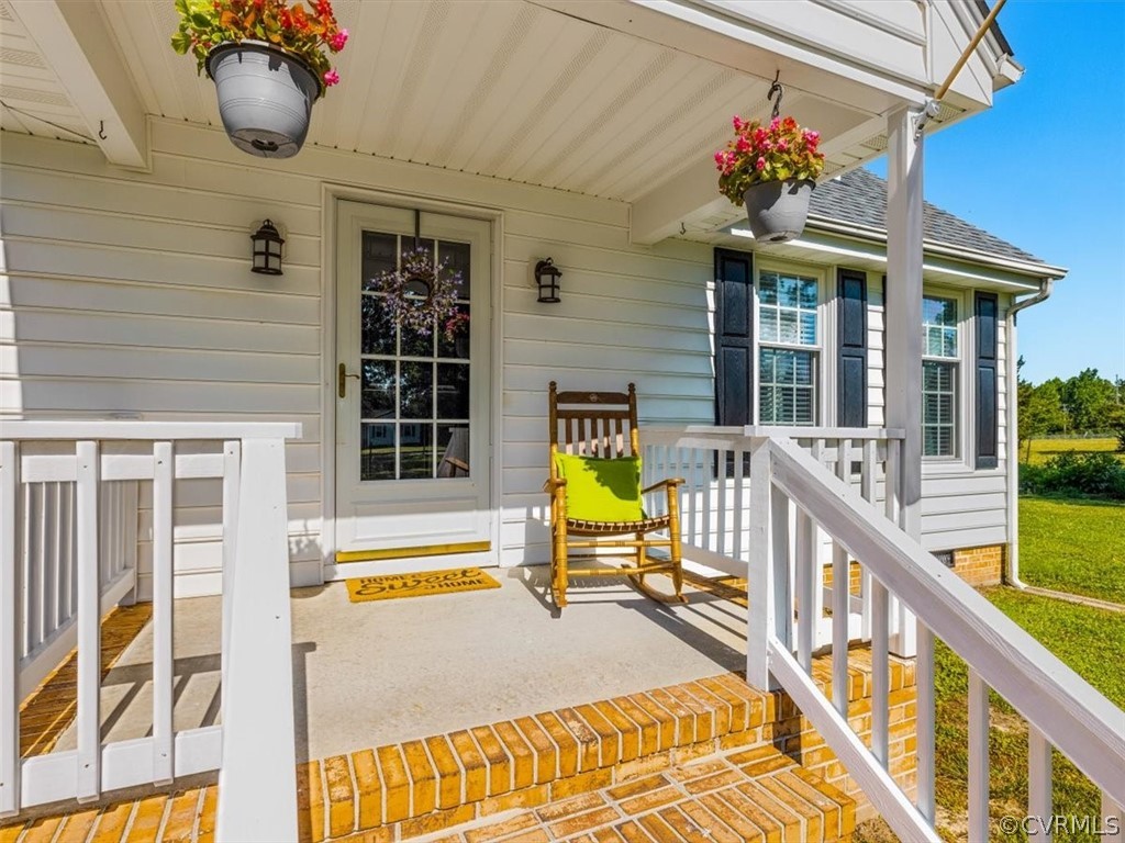 10417 River Road Petersburg, VA 23803 - Photo 3 of 29 a view of a house with swimming pool and sitting area