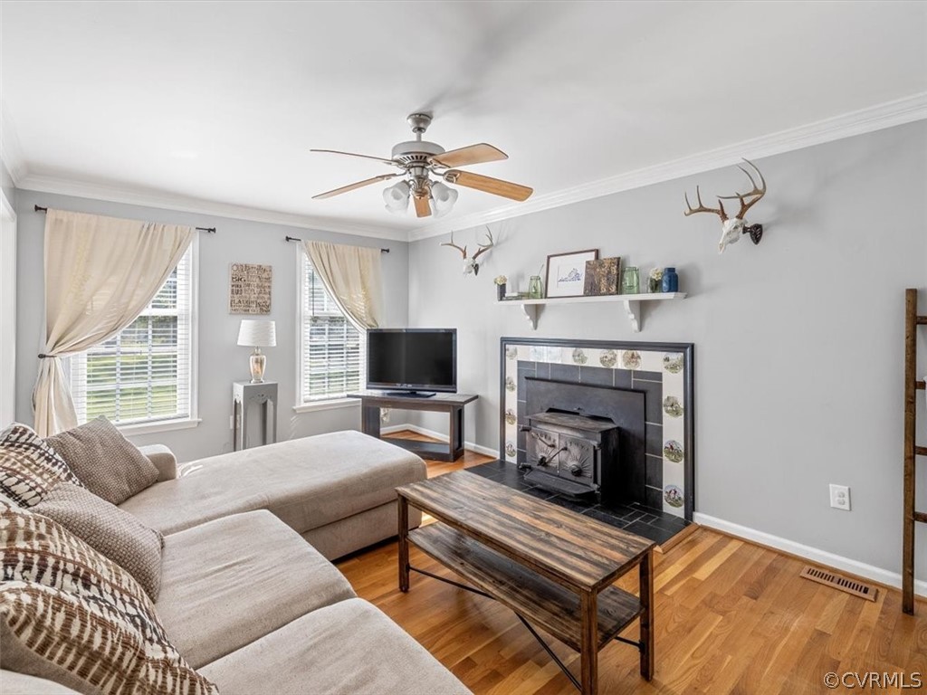 10417 River Road Petersburg, VA 23803 - Photo 7 of 29 a living room with furniture a fireplace and a flat screen tv