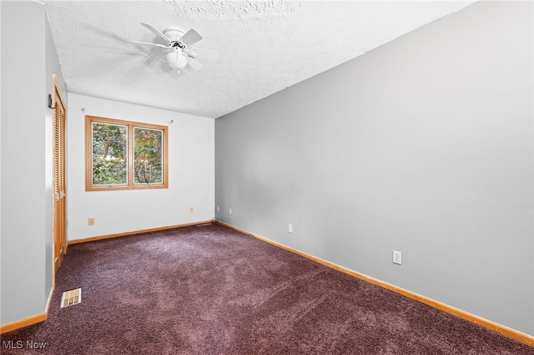 163 Burns Road Elyria, OH 44035 - Photo 21 of 37 Carpeted bedroom featuring ceiling fan