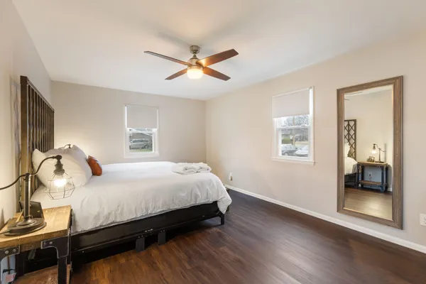 a bedroom with a bed and a window