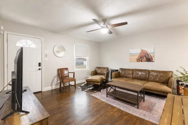 a living room with furniture and a large window