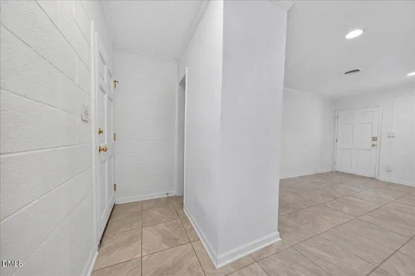 a view of a kitchen with white cabinets