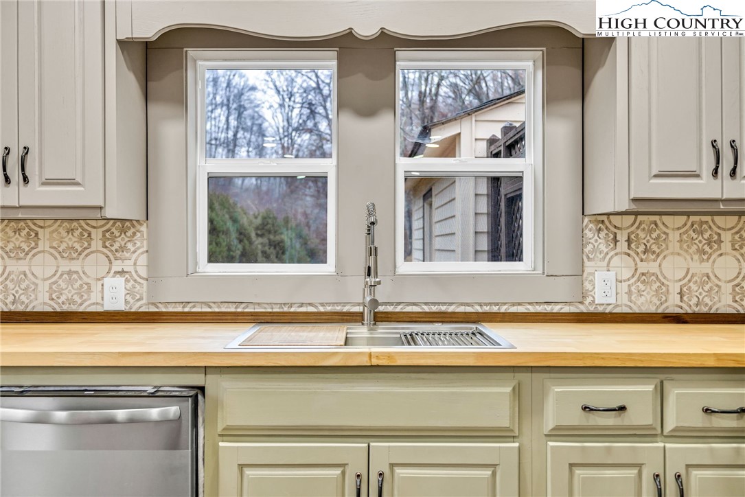 7 Legra Road Grassy Creek, NC 28631 - Photo 16 of 35 a view of a kitchen with windows and sink