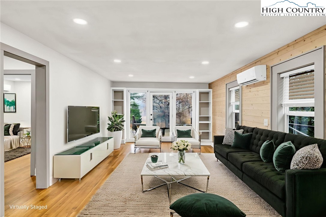 7 Legra Road Grassy Creek, NC 28631 - Photo 19 of 35 a living room with furniture and a flat screen tv
