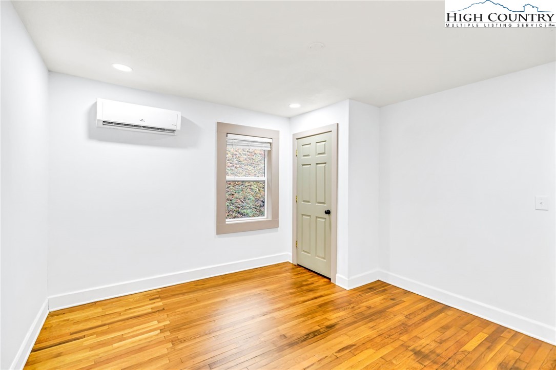 7 Legra Road Grassy Creek, NC 28631 - Photo 20 of 35 a view of empty room with wooden floor and fan