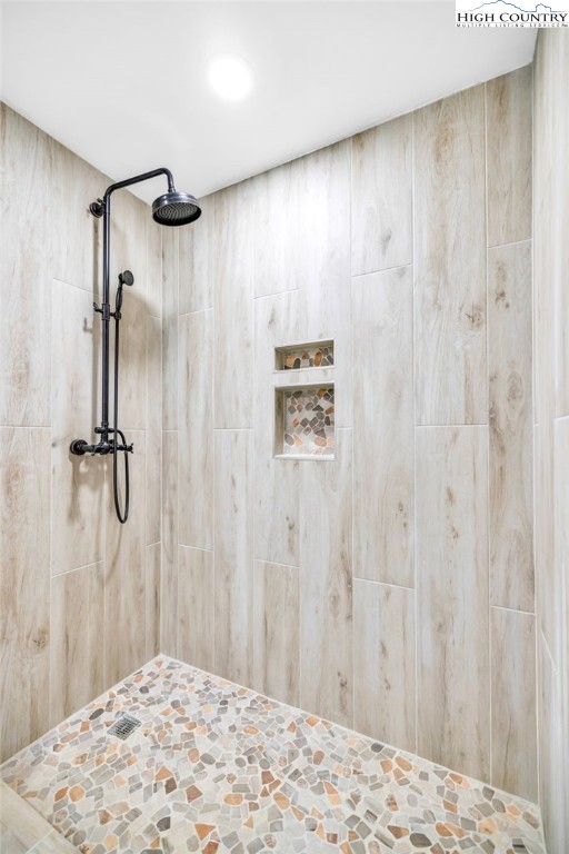 7 Legra Road Grassy Creek, NC 28631 - Photo 27 of 35 a bedroom with a bed and a wooden floor