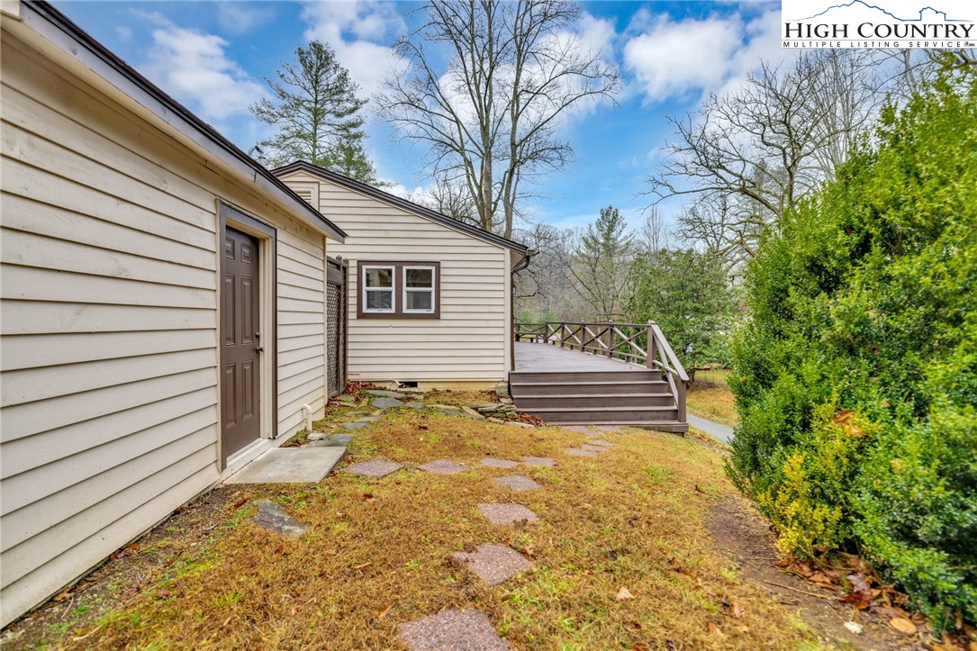 7 Legra Road Grassy Creek, NC 28631 - Photo 29 of 35 a view of a house with a yard