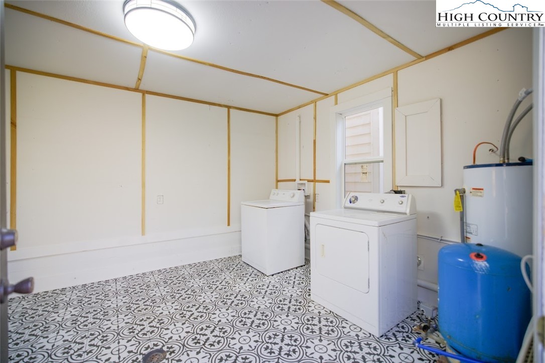 7 Legra Road Grassy Creek, NC 28631 - Photo 31 of 35 a bathroom with a sink toilet and shower
