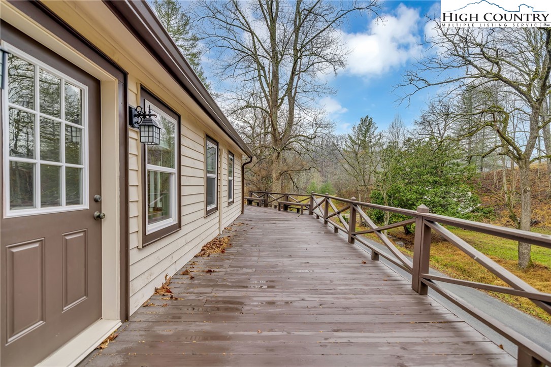 7 Legra Road Grassy Creek, NC 28631 - Photo 8 of 35 a view of balcony with wooden floor and fence