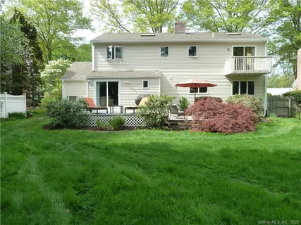 a front view of house with yard and outdoor seating
