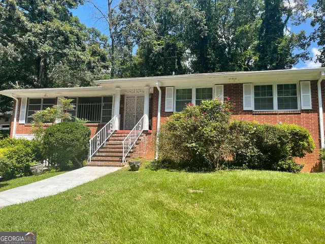 front view of a house with a yard