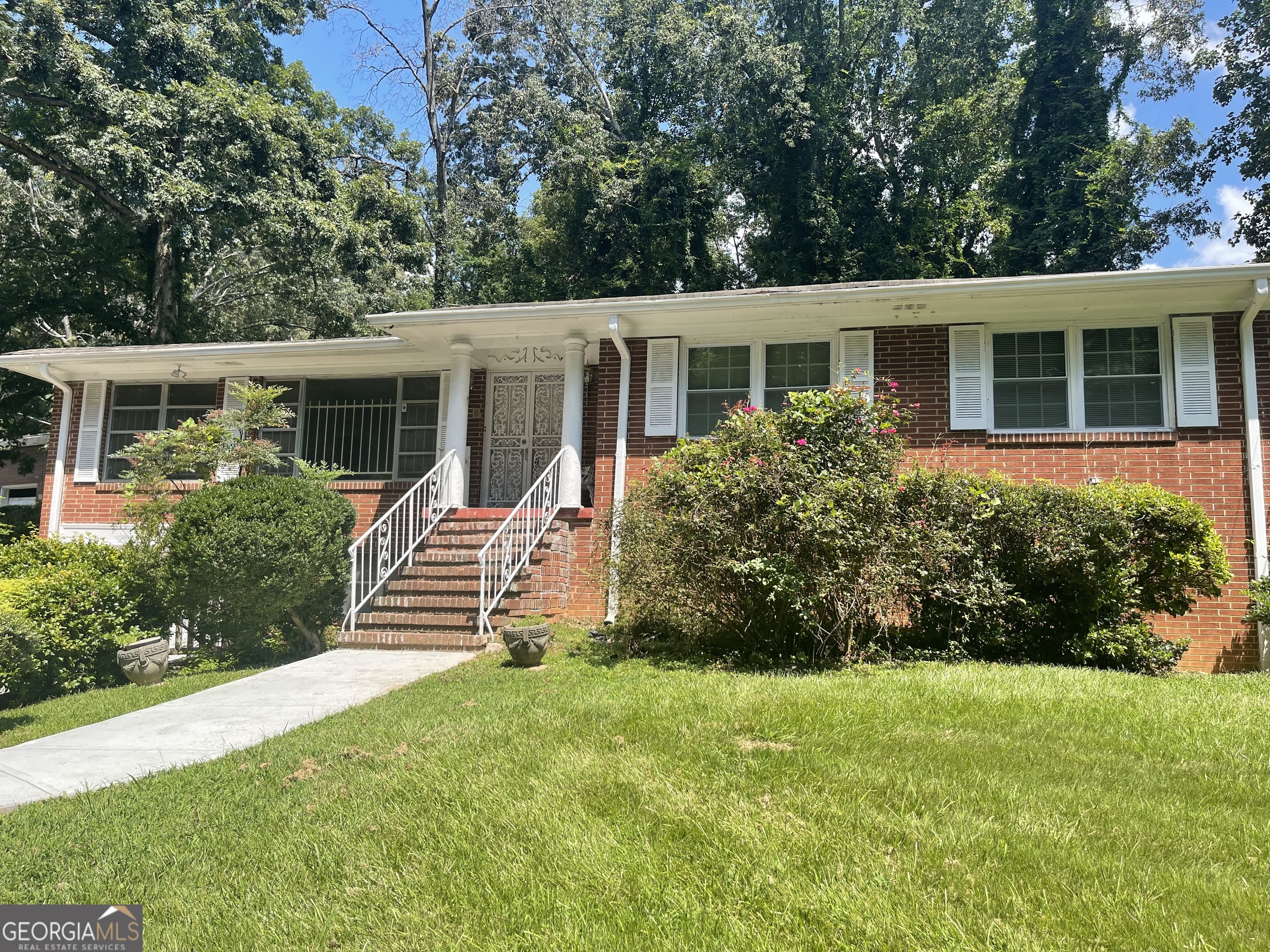3027 Collier Drive Northwest Atlanta, GA 30318 - Photo 1 of 24 front view of a house with a yard