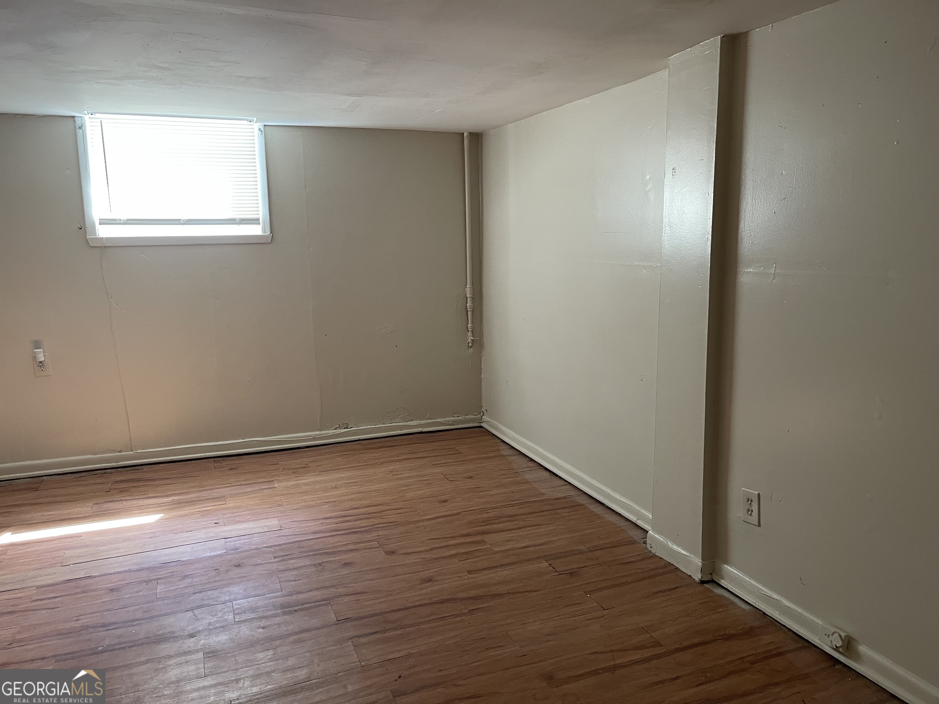 3027 Collier Drive Northwest Atlanta, GA 30318 - Photo 16 of 24 wooden floor in an empty room