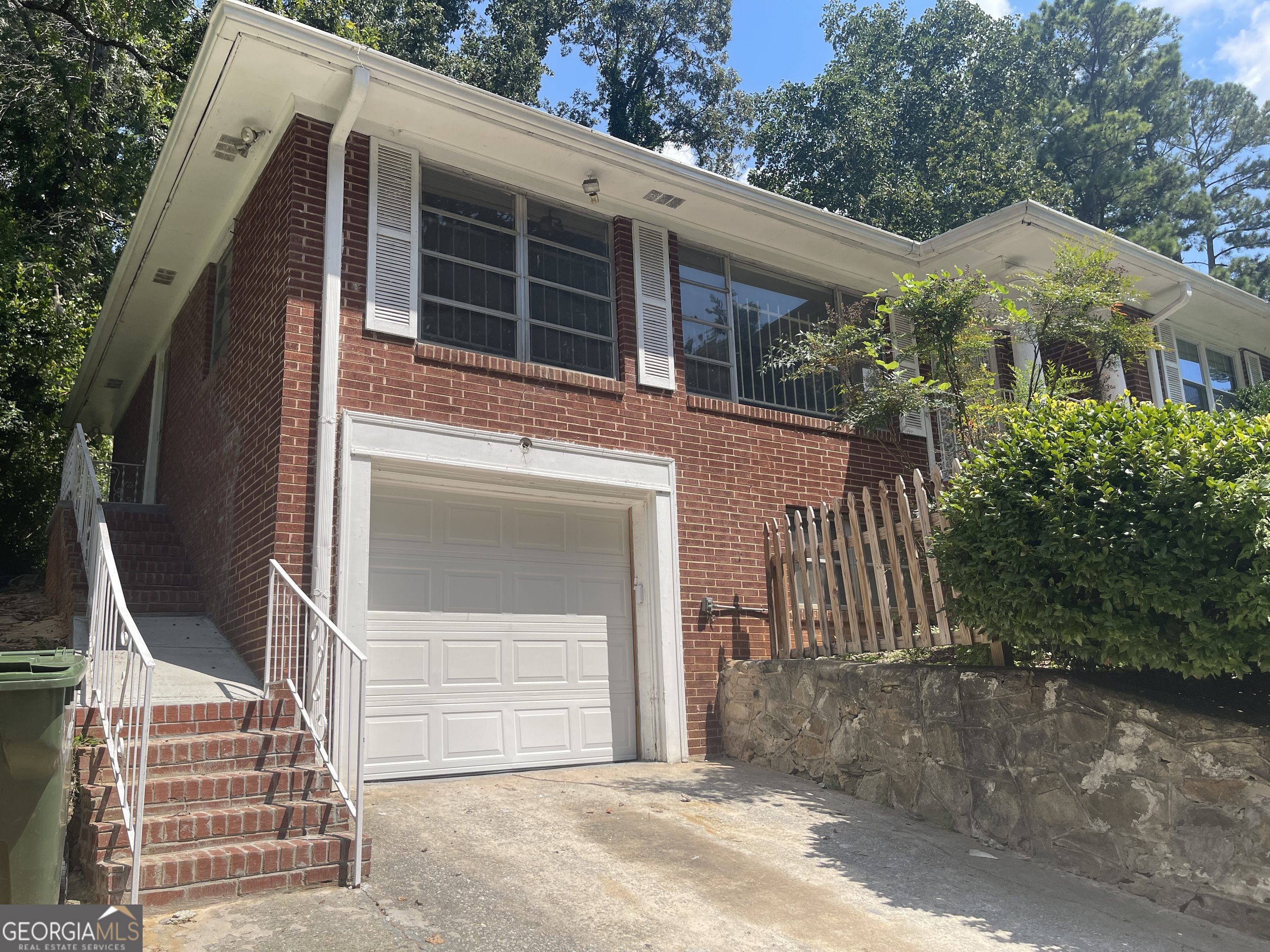 3027 Collier Drive Northwest Atlanta, GA 30318 - Photo 24 of 24 a front view of a house with a yard