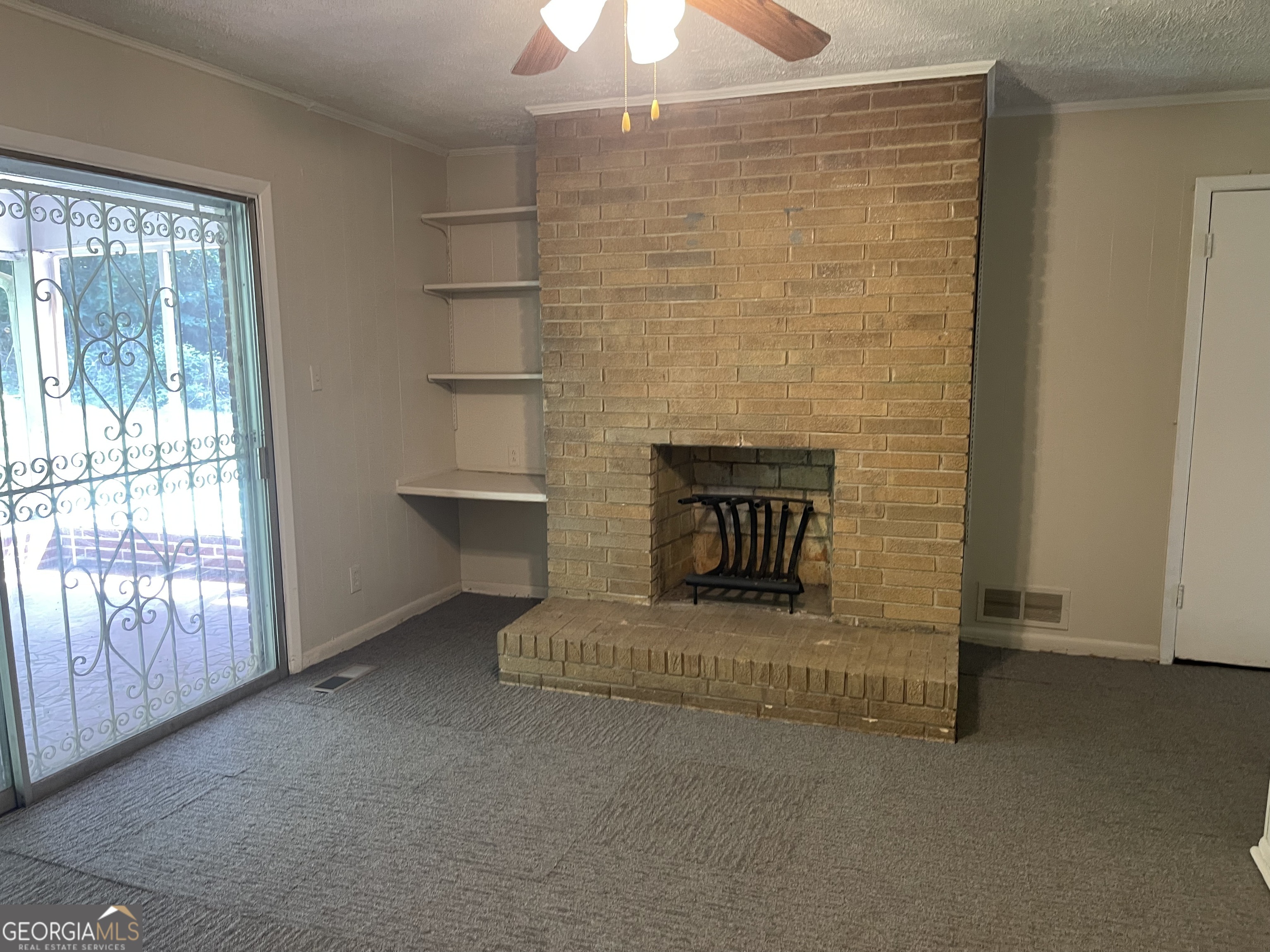 3027 Collier Drive Northwest Atlanta, GA 30318 - Photo 5 of 24 a living room with furniture and a fireplace