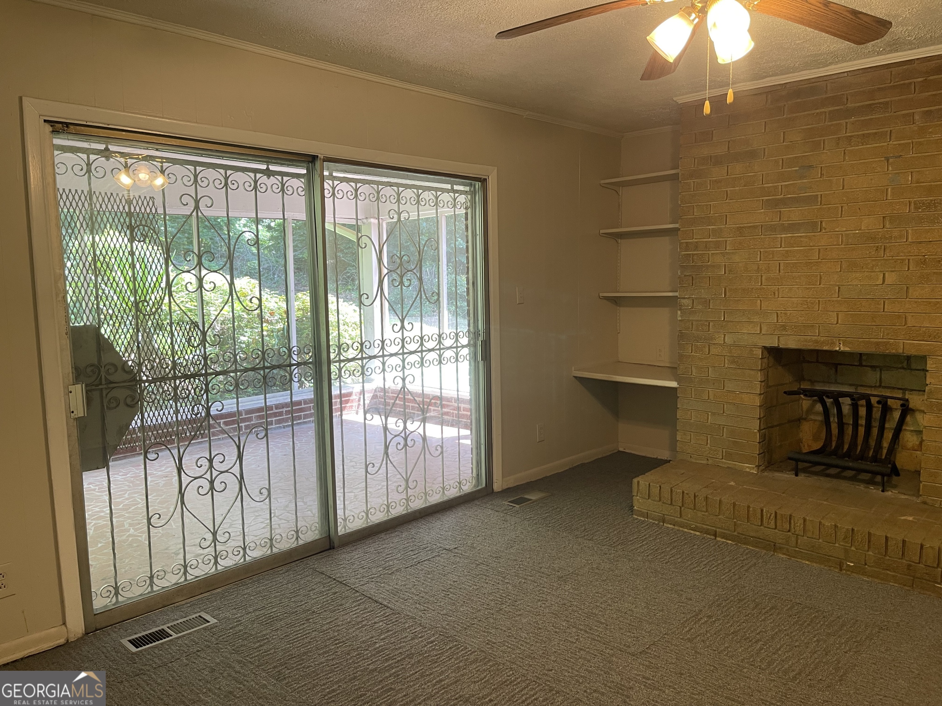3027 Collier Drive Northwest Atlanta, GA 30318 - Photo 6 of 24 a view of a room with rack on the wall