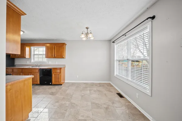 a view of a kitchen with granite countertop cabinets and a sink