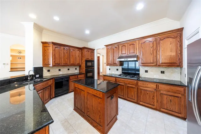 a view of kitchen and hall with wooden floor