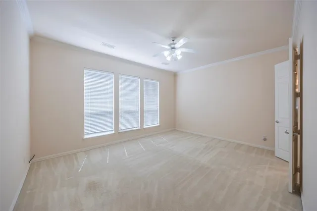 a view of a chandelier in big room and chandelier fan