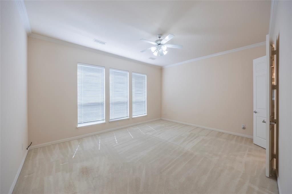 220 Justin Road Murphy, TX 75094 - Photo 17 of 40 Spare room with ceiling fan, light colored carpet, ornamental molding, and baseboards