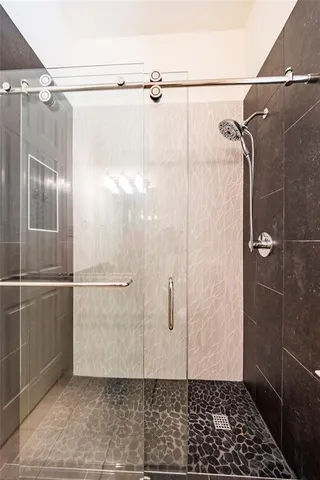 a bathroom with a granite countertop sink and a mirror with toilet