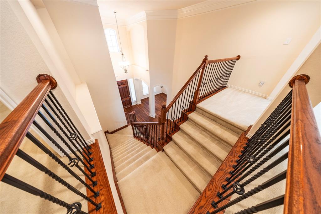 220 Justin Road Murphy, TX 75094 - Photo 25 of 40 Stairway featuring crown molding, carpet flooring, and baseboards
