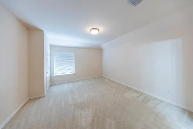 a bathroom with a granite countertop sink toilet a mirror and shower