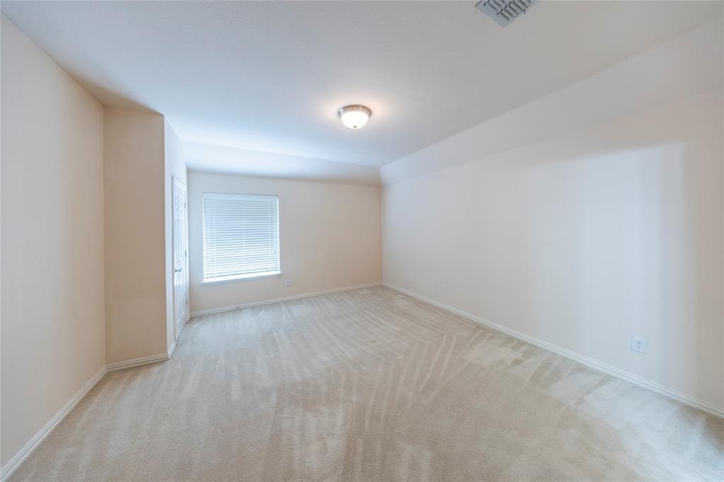 220 Justin Road Murphy, TX 75094 - Photo 31 of 40 Carpeted spare room with baseboards