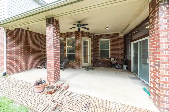 a view of a house with chair and tables