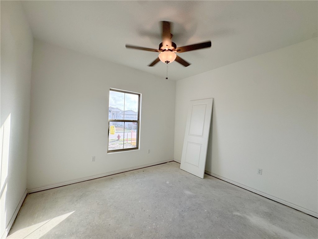 2105 Fury Portland, TX 78374 - Photo 17 of 19 an empty room with windows and closet