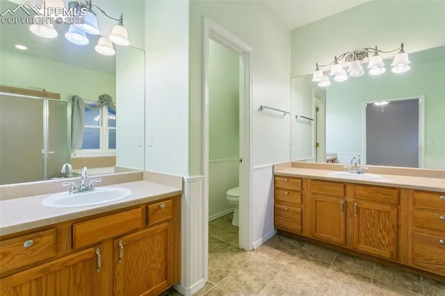 a view of a house with wooden deck and furniture