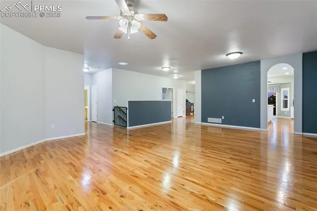 a large kitchen with kitchen island a large counter space a sink appliances and cabinets