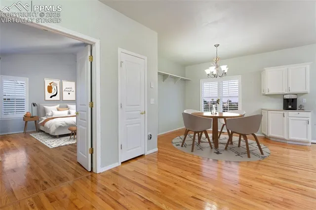 a kitchen with granite countertop cabinets stainless steel appliances and wooden floor