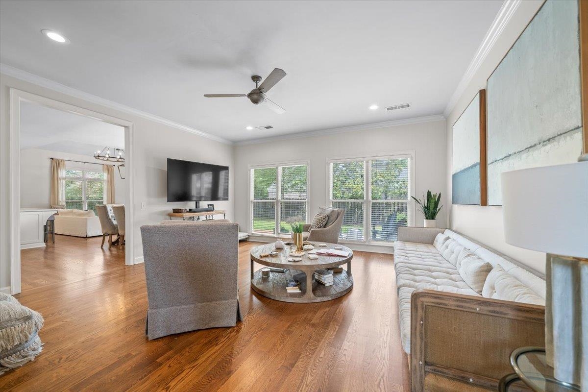 1876 Liles Lane Collierville, TN 38017 - Photo 12 of 36 Open-concept living space featuring wood-finish flooring, a ceiling fan, recessed lighting, and expansive windows