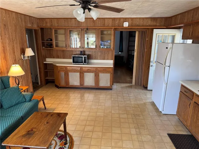 a living room with a couch and a walk in closet