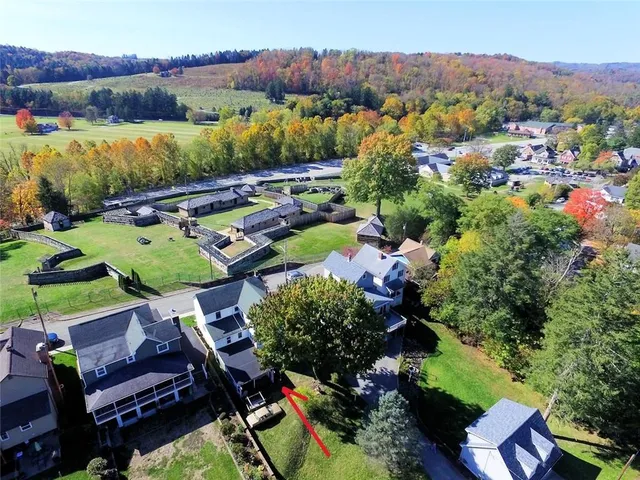 an aerial view of a house with a garden