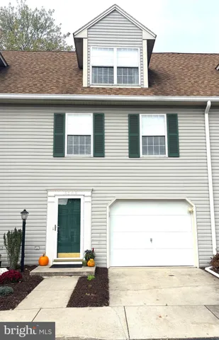 a view of a house with a street