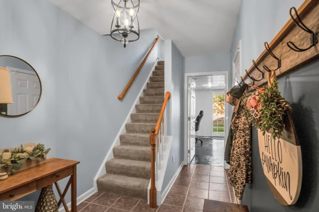 a view of a hallway with a chandelier