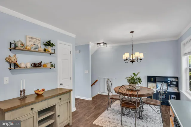 a kitchen with stainless steel appliances a stove refrigerator sink and a window