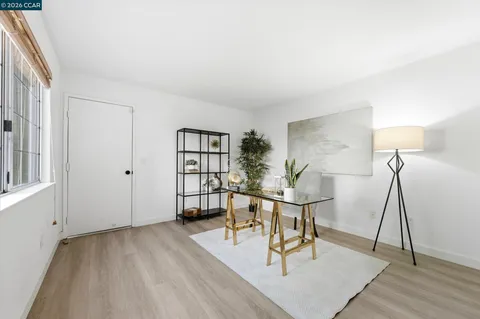 a view of a livingroom with furniture and wooden floor