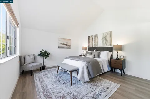 a bed room with a bed and a couch