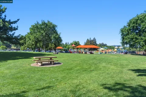 a view of a park with houses